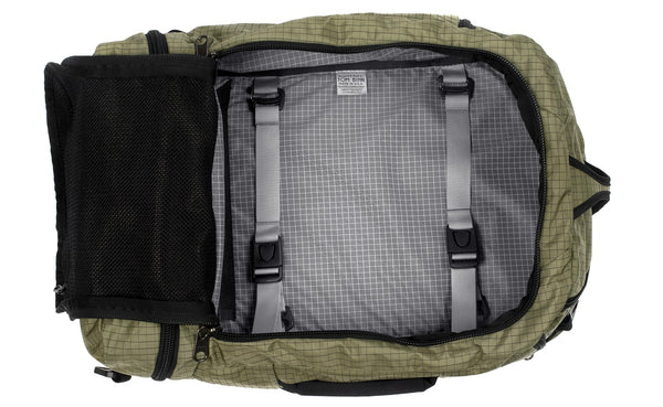 An open Techonaut 45 with a Taiga (sage green) Halcyon exterior and a Northwest Sky (grey) interior.